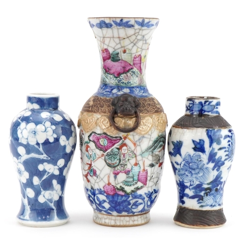 243 - Three Chinese porcelain vases including two baluster examples, one hand painted with prunus flowers,... 