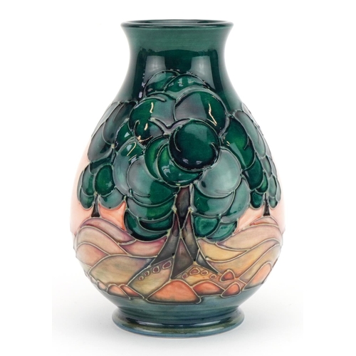 142 - Moorcroft pottery baluster vase hand painted in the Mamoura pattern, 19cm high