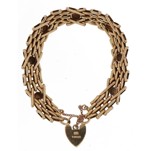 2002 - 9ct gold four row gate link bracelet with love heart padlock and safety chain, 18.9g