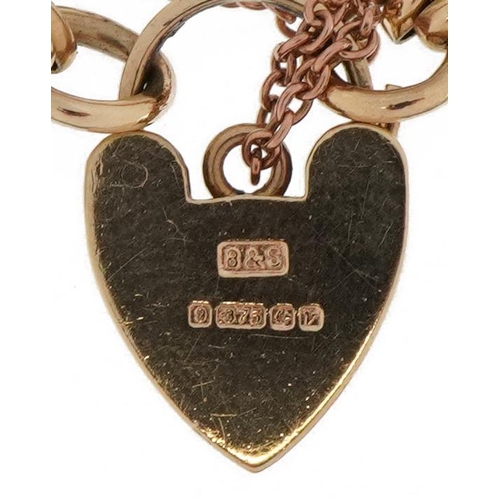 2002 - 9ct gold four row gate link bracelet with love heart padlock and safety chain, 18.9g