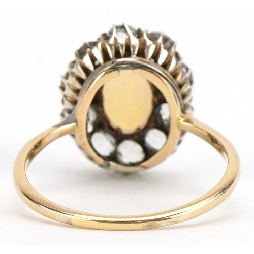 2011 - 18ct gold cabochon opal and white sapphire cluster ring, the opal approximately 10.3mm x 6.6mm, the ... 