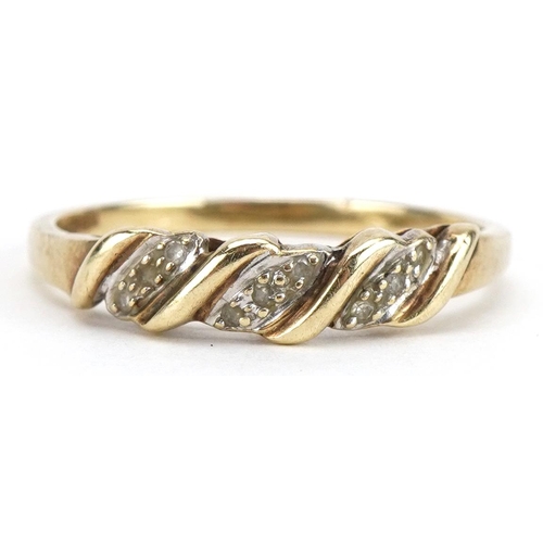 2163 - 9ct gold clear stone crossover ring, size U, 2.1g