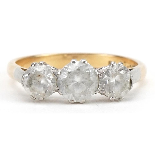 2208 - 18ct gold and platinum clear stone trilogy ring, tests as sapphire, the largest stone approximately ... 