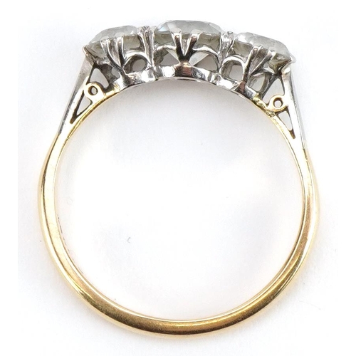 2208 - 18ct gold and platinum clear stone trilogy ring, tests as sapphire, the largest stone approximately ... 