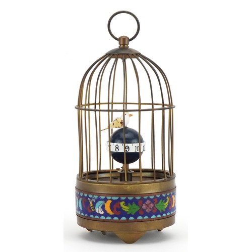 1302 - Brass and cloisonne clockwork automaton bird cage with alarm clock, 19.5cm high