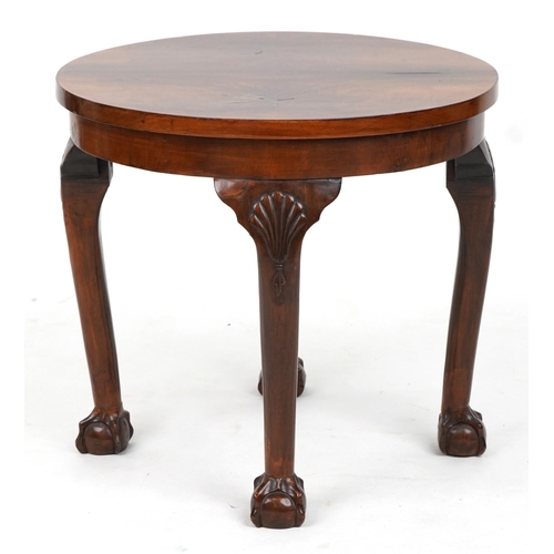 1039 - Circular walnut quarter veneered occasional table with shell carved knees and ball and claw feet, 49... 