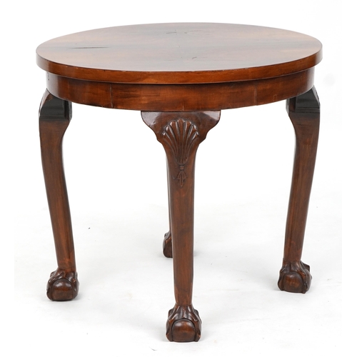 1039 - Circular walnut quarter veneered occasional table with shell carved knees and ball and claw feet, 49... 