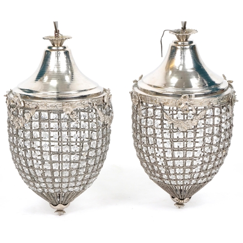 1056 - Pair of ornate silvered metal acorn chandeliers with swags and bows, 58cm high