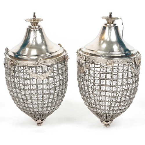 1056 - Pair of ornate silvered metal acorn chandeliers with swags and bows, 58cm high