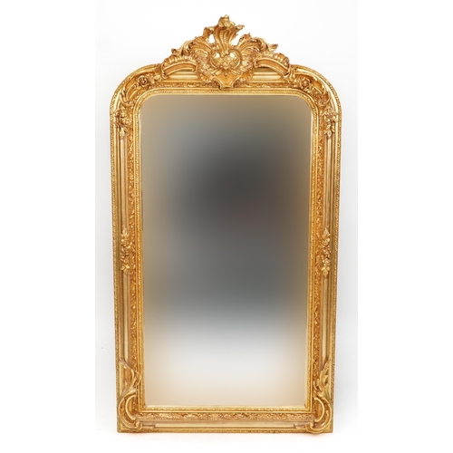 1017 - Large ornate gilt framed wall mirror with bevelled glass 158cm high x 84cm wide