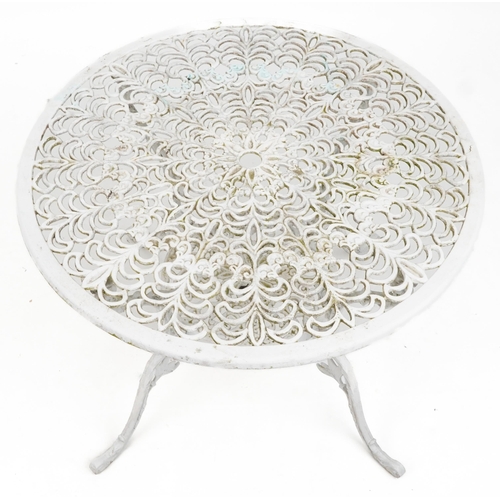 1142 - White painted aluminium garden table and four chairs, the table 67cm high x 87cm in diameter