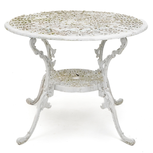 1142 - White painted aluminium garden table and four chairs, the table 67cm high x 87cm in diameter