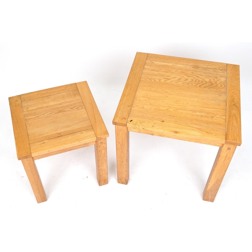 1093 - Two contemporary light oak occasional tables, the largest 55.5cm H x 60cm W x 60cm D