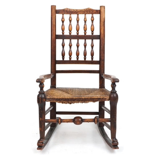 1094 - Antique elm rocking chair with cane seat, 88cm high