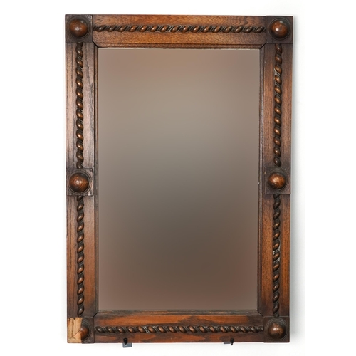 1068 - Arts & Crafts oak wall hanging mirror with bevelled glass, 82cm x 56cm