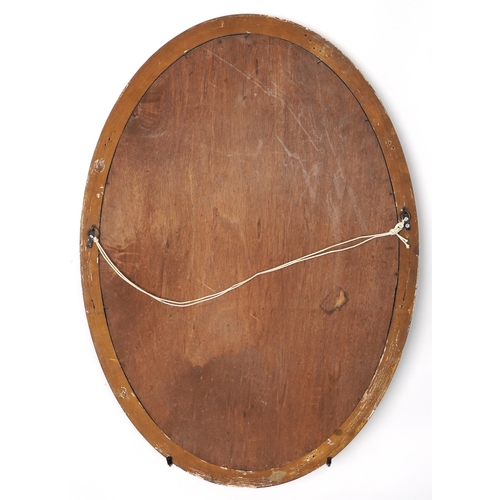 1071 - Oval gilt framed wall hanging mirror with bevelled glass, 85cm x 60cm