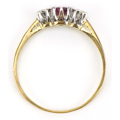 2103 - 9ct gold ruby and diamond three stone ring, the ruby approximately 3.2mm in diameter, size Q/R, 1.1g