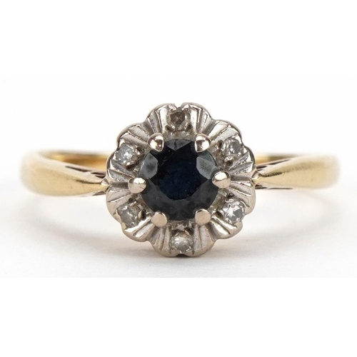 2289 - 18ct gold sapphire and diamond cluster ring, the sapphire approximately 4.4mm in diameter, size L/M,... 