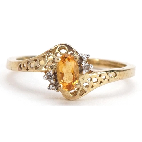 2337 - 9ct gold citrine and diamond crossover ring with pierced shoulders, size L, 1.5g