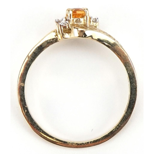 2337 - 9ct gold citrine and diamond crossover ring with pierced shoulders, size L, 1.5g