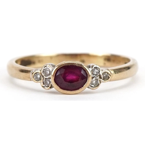 2331 - 9ct gold ruby and diamond seven stone ring, the ruby approximately 4.6mm x 3.5mm, size P, 1.9g