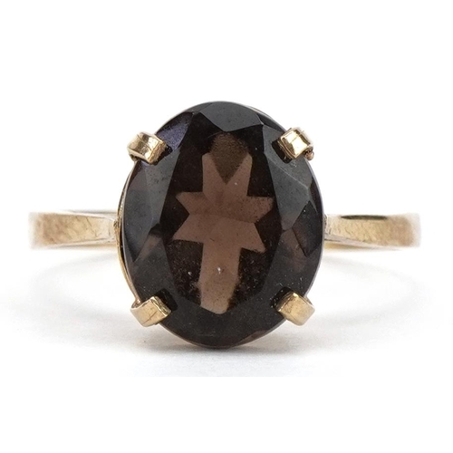 2172 - 9ct gold smoky quartz solitaire ring, the smoky quartz approximately 11.9mm x 9.7mm, size R, 2.4g