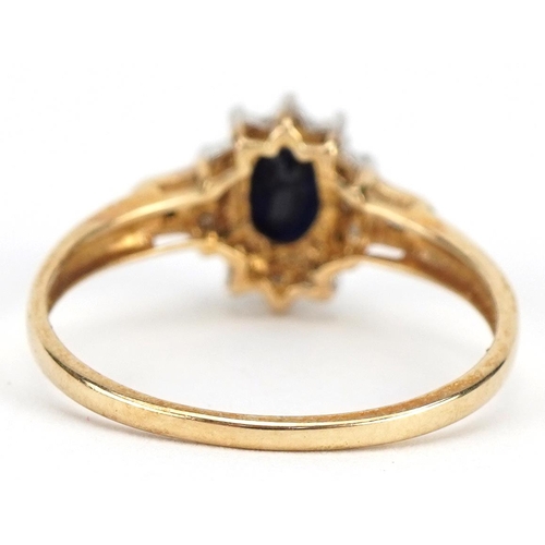 2170 - 9ct gold sapphire and diamond cluster ring, the sapphire approximately 6.1mm x 4.1mm, size M, 1.4g