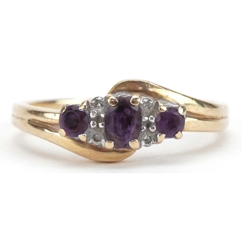 2279 - 9ct gold amethyst and diamond seven stone crossover ring, size N, 2.1g