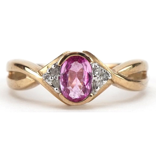 2264 - 9ct gold ruby and diamond seven stone ring, the ruby approximately 5.9mm x 3.9mm, size L, 2.4g