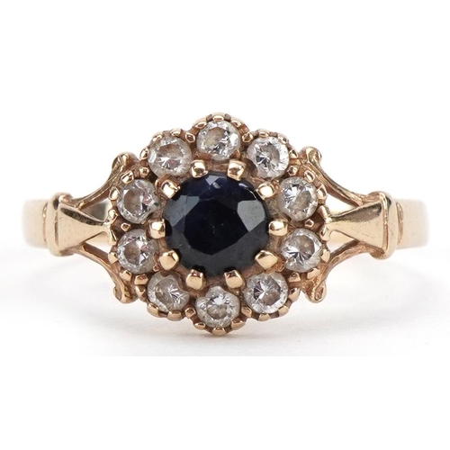 2166 - 9ct gold sapphire and clear stone flower head ring, size I, 1.2g