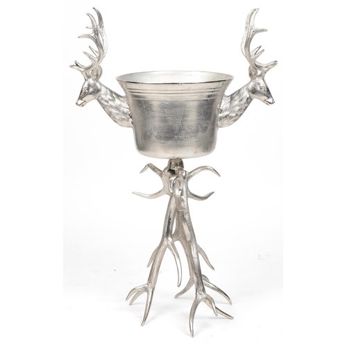 1013 - Brutalist style silvered metal floor standing ice bucket with two stag's heads, 105cm high x 70cm wi... 