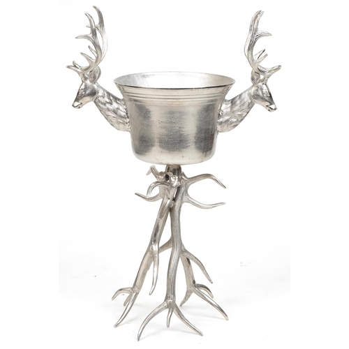 1013 - Brutalist style silvered metal floor standing ice bucket with two stag's heads, 105cm high x 70cm wi... 