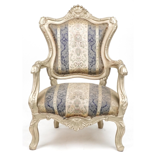 1106 - French style ornate gilt open armchair with blue and cream striped floral upholstery, 110cm high