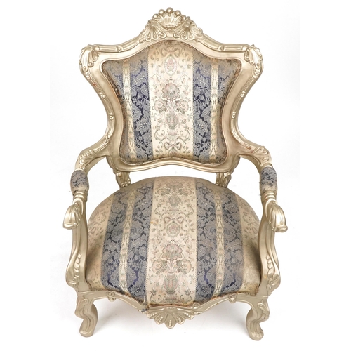 1106 - French style ornate gilt open armchair with blue and cream striped floral upholstery, 110cm high