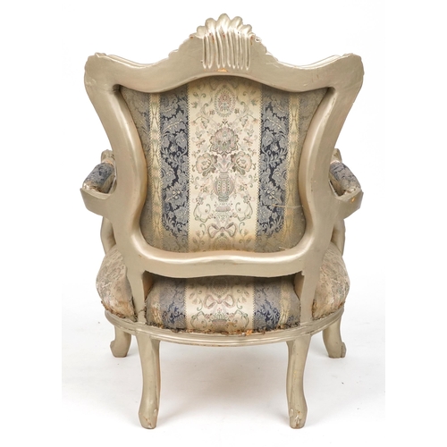 1106 - French style ornate gilt open armchair with blue and cream striped floral upholstery, 110cm high