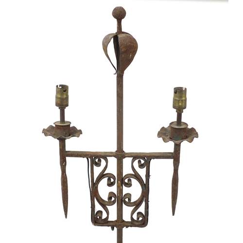 1139 - In the style of Gordon Russell Broadway wrought iron two branch candle stand , 175cm high