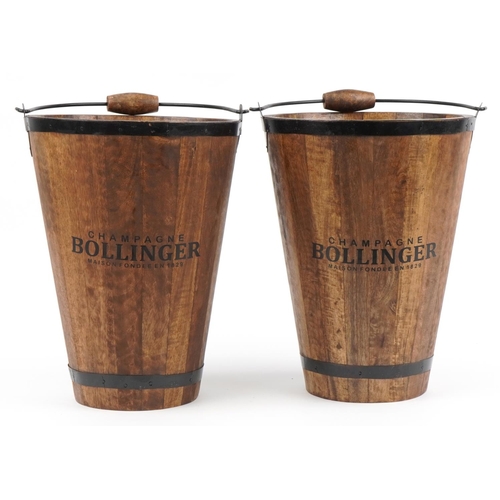 1173 - Pair of wooden barrel design Champagne ice buckets with Bollinger mottos, 40cm high