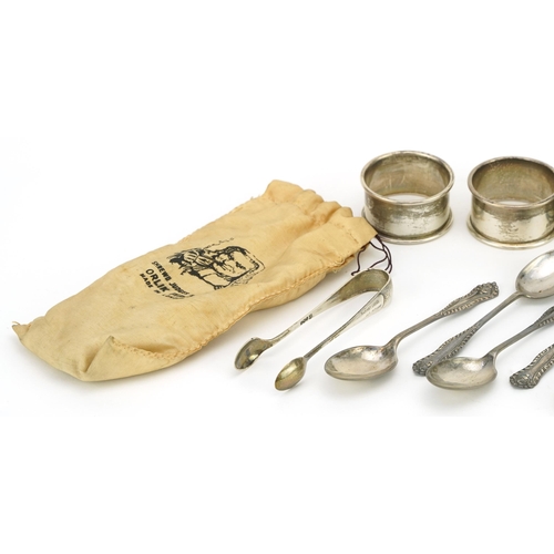 312 - Edwardian and later silver comprising set of six teaspoons, four napkin rings, sugar tongs and musta... 