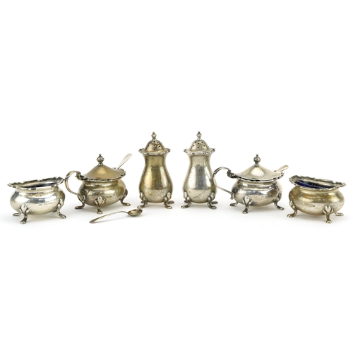 235 - Adie Brothers, George V silver six piece cruet with blue glass liners, Birmingham 1928, the largest ... 