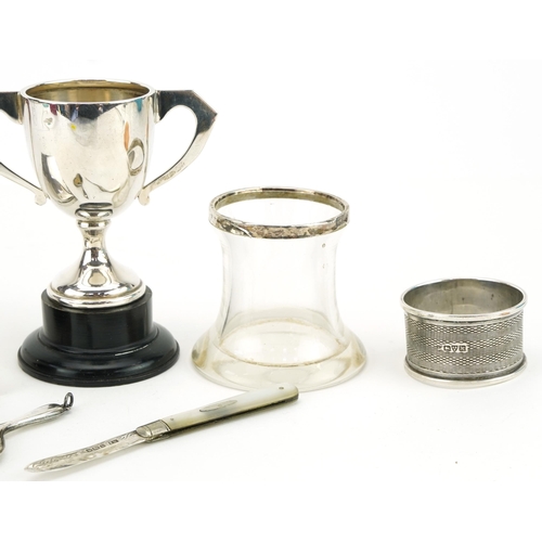 234 - Silver objects including a cigarette box, twin handled trophy and mother of pearl folding fruit knif... 