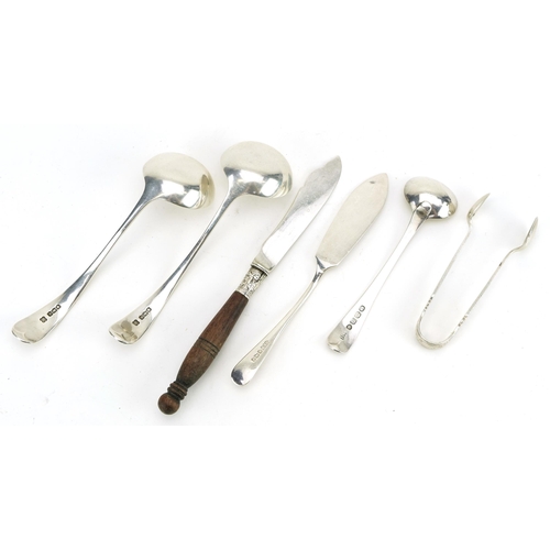 176 - Silver flatware including a pair of ladles and sugar tongs, various hallmarks, the largest 13cm in l... 