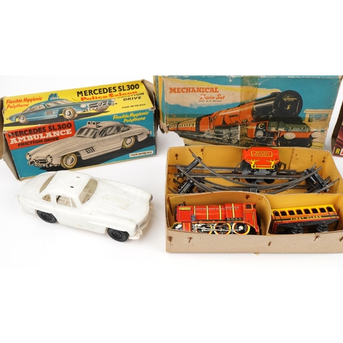 1470 - Vintage tinplate toys with boxes comprising mechanical train set, Mercedes SL300 friction drive ambu... 