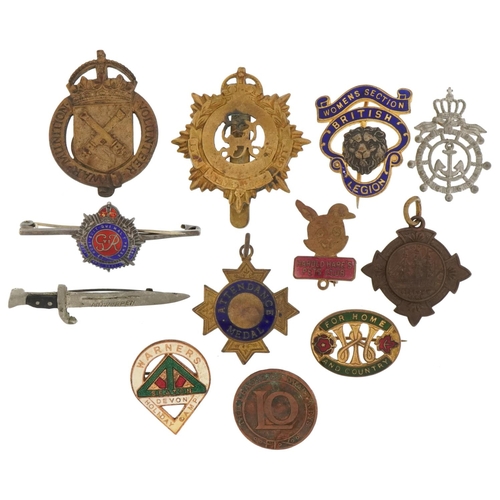 1522 - Predominantly Military and naval interest badges, brooches and cap badges including one in the form ... 