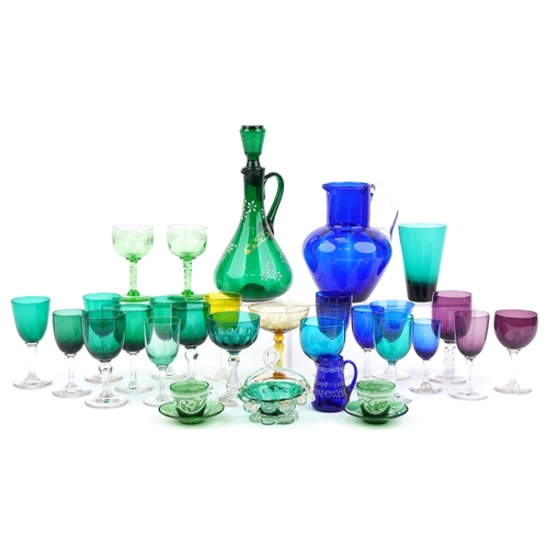 568 - Early 19th century and later glassware including Bristol blue jug, green claret jug enamelled with f... 