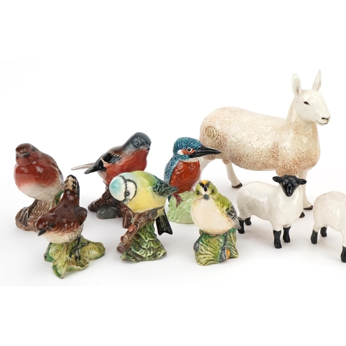 432 - Twelve Beswick animals comprising six birds, four dogs and two sheep together with two Border Fine A... 