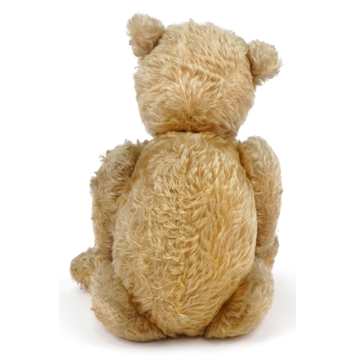 1400 - Old golden straw filled teddy bear with jointed limbs, 52cm in length