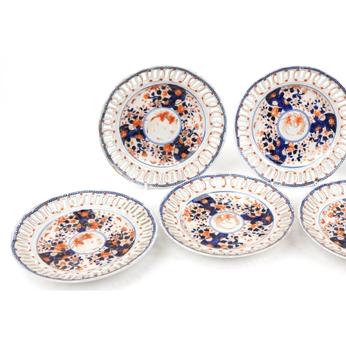 574 - Seven Japanese Imari porcelain plates with pierced borders hand painted with flowers, each 22.5cm in... 