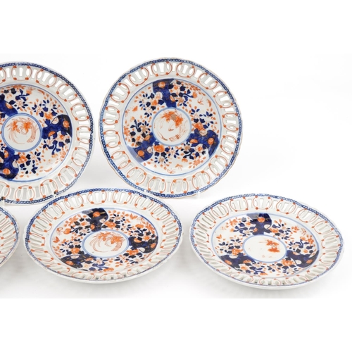 574 - Seven Japanese Imari porcelain plates with pierced borders hand painted with flowers, each 22.5cm in... 