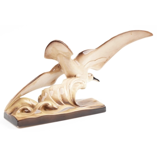 252 - Art Deco style pottery sculpture in the form of a stylised gull, 74cm in length