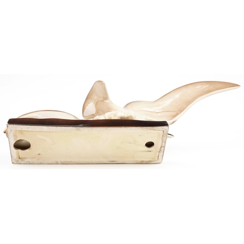 252 - Art Deco style pottery sculpture in the form of a stylised gull, 74cm in length